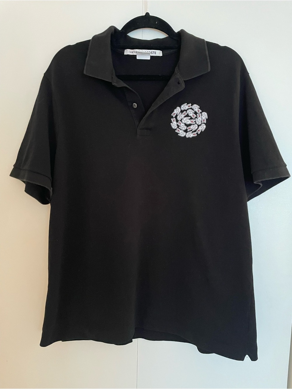 Lacoste + Campanas Black Polo with Embroidered Chest Motif